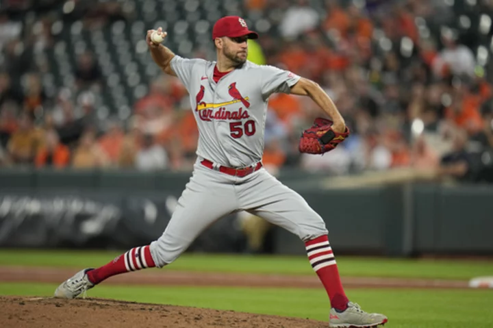 Adam Wainwright finally earns his 199th victory, and Cardinals top AL-leading Orioles 5-2