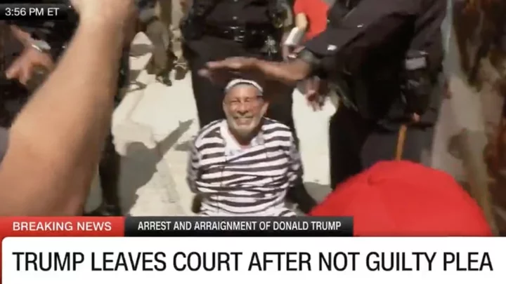 Man in Black and White Prisoner Pinstripes Arrested For Running Towards Donald Trump's Motorcade