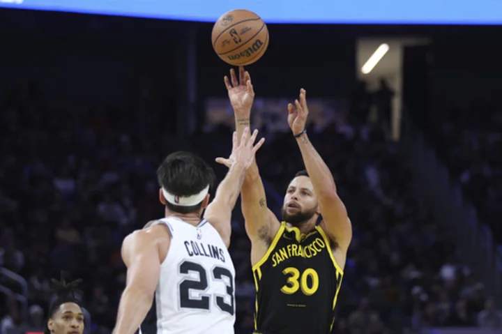 Stephen Curry scores 35 points with seven 3-pointers as Warriors hold off Spurs 118-112