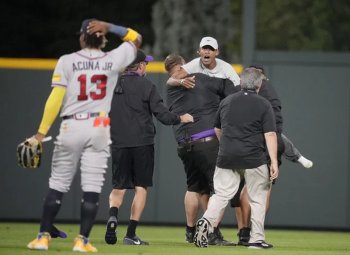 Acuña fends off fans, ties career highs with 4 hits and 5 RBIs in Braves' 14-4 rout of Rockies