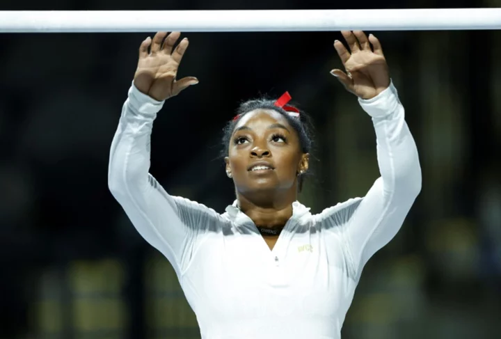 Biles will open on uneven bars in return to competition