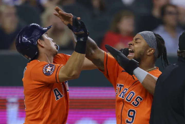 McCormick's bases-clearing triple lifts the Astros over the Rangers 5-3