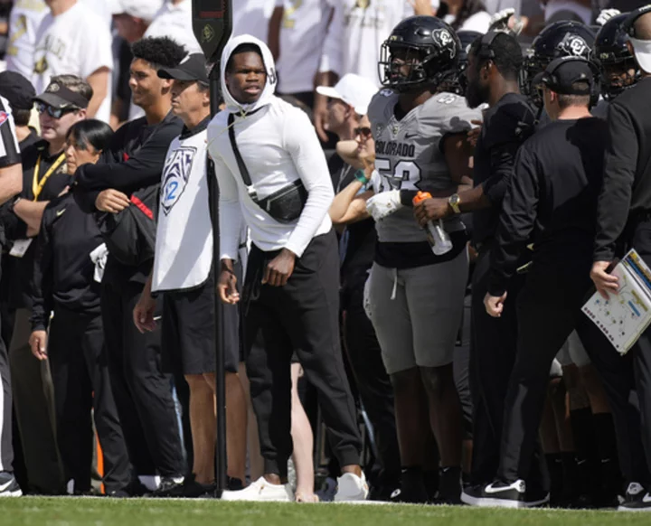 Injured receiver/defensive back Travis Hunter helps Colorado by lending his expertise as a coach