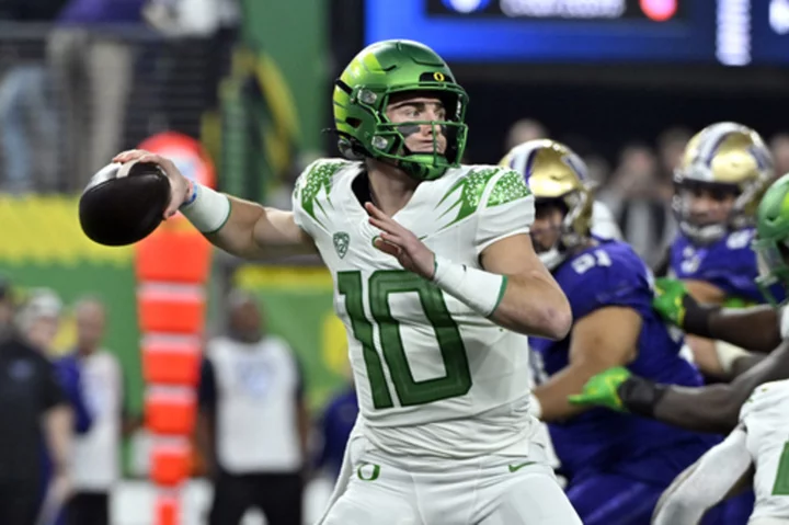 Oregon quarterback Bo Nix dejected after loss in Pac-12 championship, mum on status for bowl game