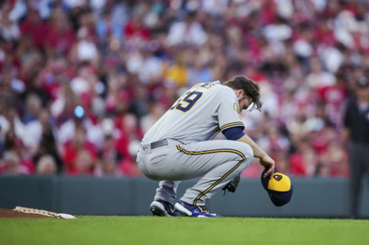 Corbin Burnes recovers from heat scare and strikes out 13 as Brewers edge Reds 1-0