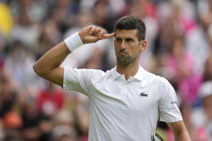 Novak Djokovic and Iga Swiatek won at Wimbledon. Protesters and rain captured the attention