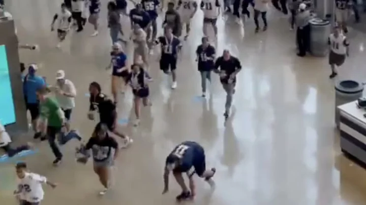 Two Cowboys Fans Caught Falling Down While Running Into AT&T Stadium For Home Opener