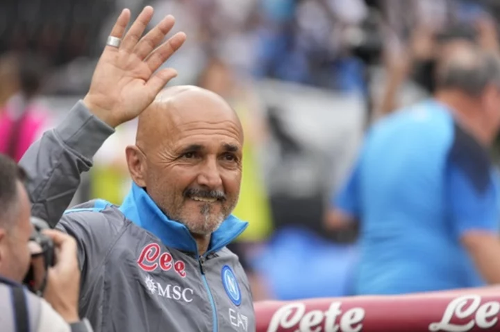 Spalletti carries 'giant' Italian flag his mom made for him to national team job