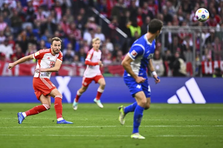 Harry Kane imitates David Beckham by scoring from his own half for Bayern Munich