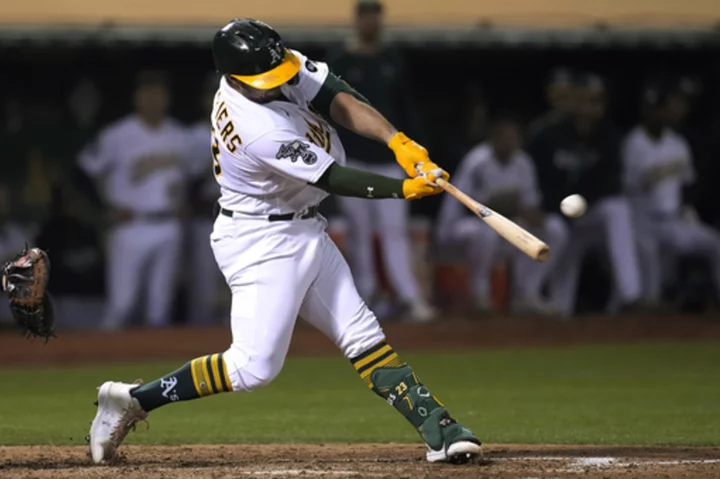 A's rally to beat Tigers 8-2 and end 8-game losing streak