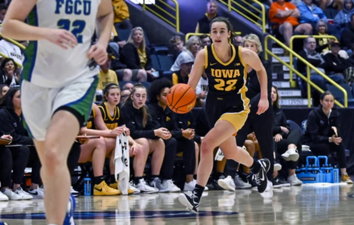 Caitlin Clark scores 21 and No. 5 Iowa makes 20 3's to roll past Florida Gulf Coast 100-62