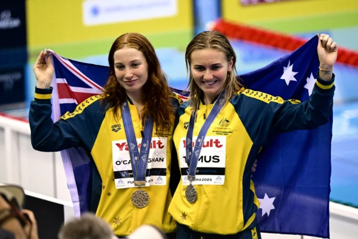 O'Callaghan breaks record as Marchand adds more swimming gold