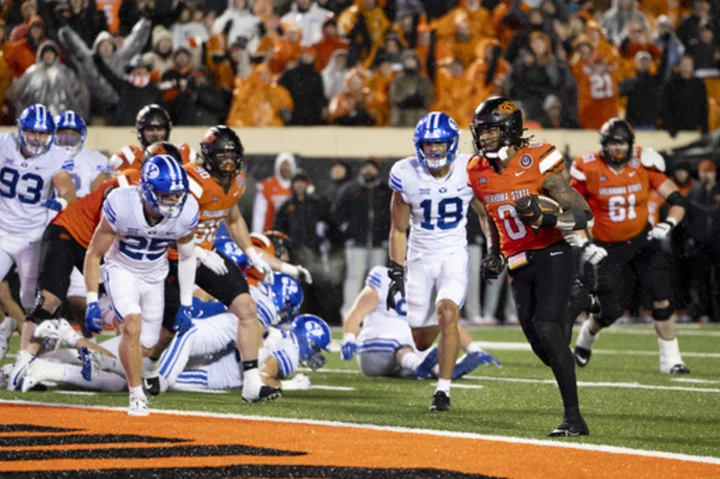 Ollie Gordon II's 5 TDs lead No. 21 Oklahoma State past BYU in 2OT, into Big 12 title game