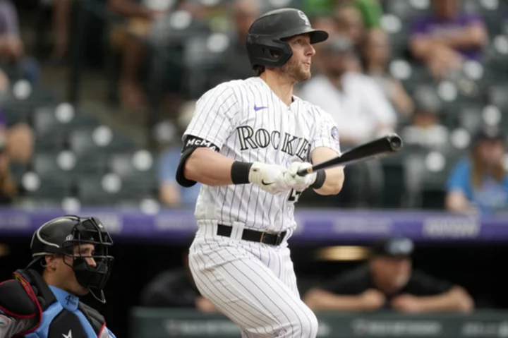Tovar's single in storm lifts Rockies over Marlins 7-6 after blown 4-run lead