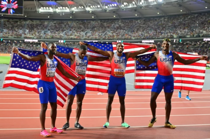 Lyles wins third world gold after anchoring US relay to victory