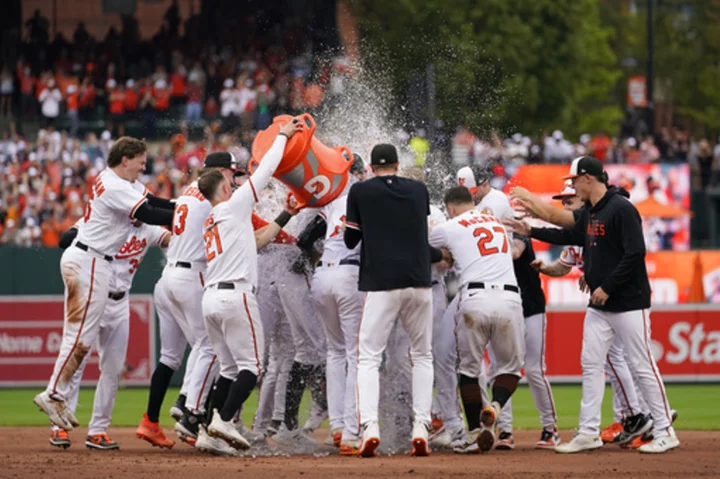 Orioles beat Rays 5-4 in 11-inning thriller after both teams clinch postseason spots