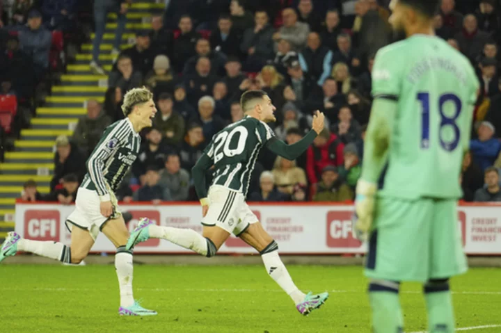 Dalot scores winner as Man United beats Sheffield United 2-1 'on a sad day' after Charlton's death
