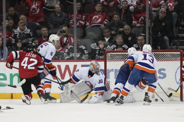Lazar scores winner with 23 seconds left as the Devils rally past the Islanders 5-4