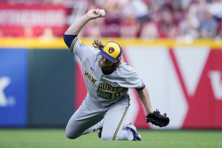 Brewers overcome Burnes' ejection to beat Reds 5-4 in 11 innings