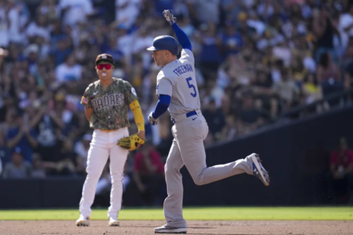 Freeman, Rosario and Betts homer to back Lynn in the Dodgers' 8-2 win against the Padres