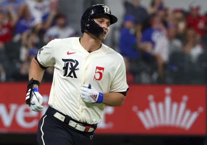 Rangers All-Star SS Seager leaves game against former team after hurting hand