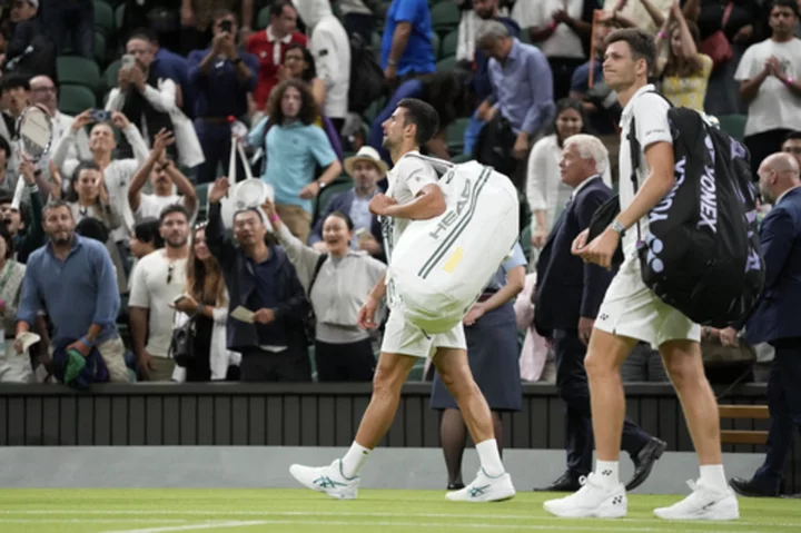 Novak Djokovic's Wimbledon match against Hubert Hurkacz was suspended and will continue Monday