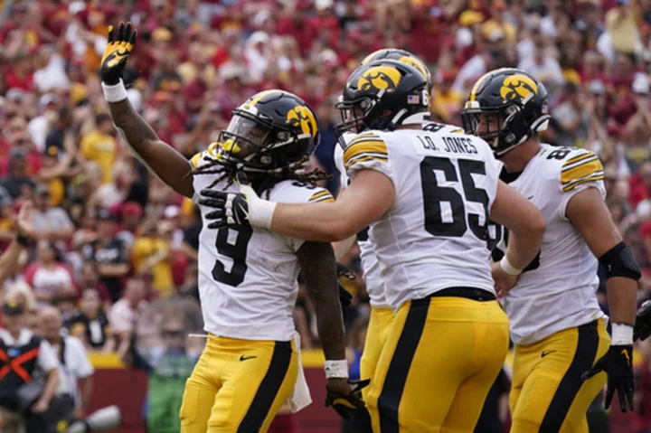 Hawkeyes reclaim Cy-Hawk Trophy after holding off Iowa St. late in 20-13 win with Trump on hand