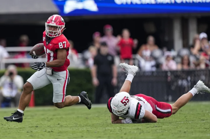 No. 1 Georgia romps 45-3 over Ball State behind Mews' punt return TD, 3 interceptions