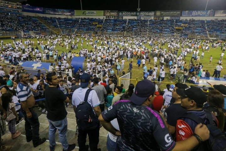 Authorities investigate El Salvador stadium crush with at least nine people dead