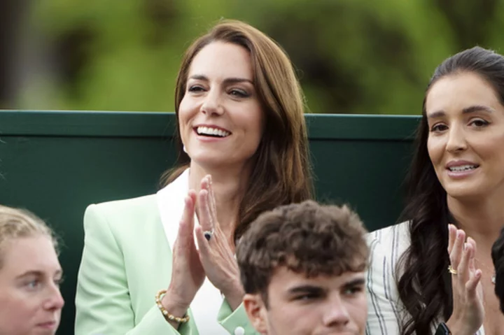Princess Kate visits Wimbledon. Rain interrupts play for the 2nd straight day