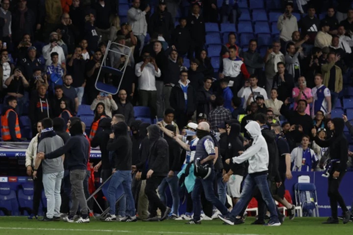 Early end to Barcelona's title celebrations after Espanyol fans invade pitch