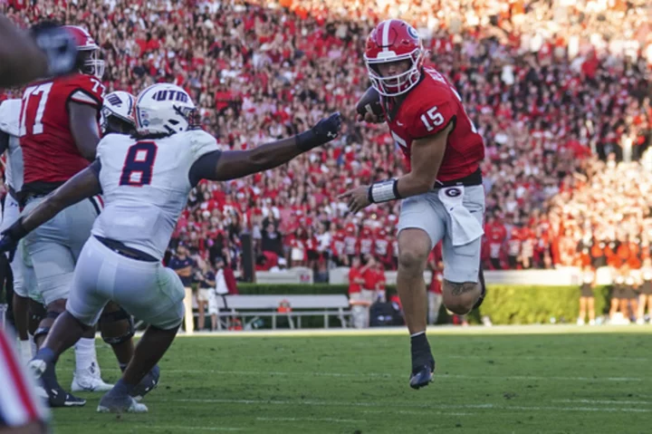 Beck throws and runs for TDs to launch new era as No. 1 Georgia rolls past UT-Martin 48-7