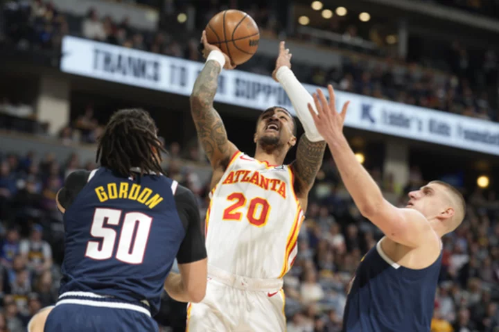 Hawks clear cap room, trade Collins to Jazz for Gay, future 2nd rounder, AP source says