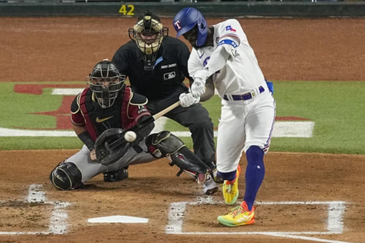 Rangers slugger Adolis García matches MLB postseason record with 21st RBI in World Series opener