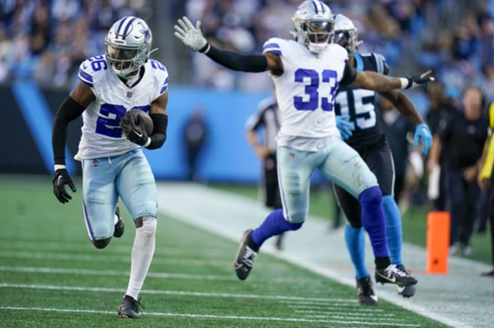 Prescott throws 2 TDs, Bland ties NFL record with 4th pick-6 in Cowboys' 33-10 rout of Panthers