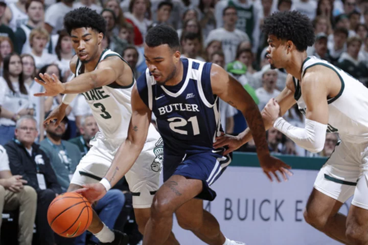 Walker scores 21, leads No. 18 Michigan State to a 74-54 win over Butler