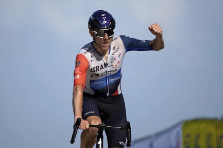 Woods secures big win at top of famed Tour de France mountain as Pogacar closes gap on Vingegaard