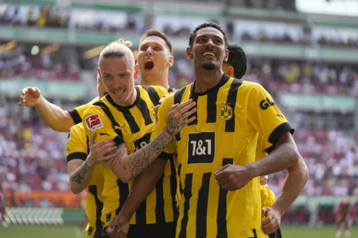 Haller fires Dortmund to the top of the Bundesliga, just 1 round left