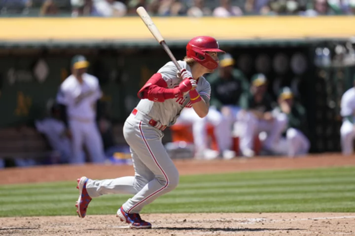 Schwarber hits go-ahead single in 12th, Stott drives in two as Phillies beat Athletics 3-2